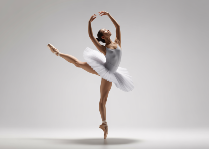 Professional photo of a ballet dancer demonstrating a graceful arabesque, representing dance education and teacher training at the National Ballet School.