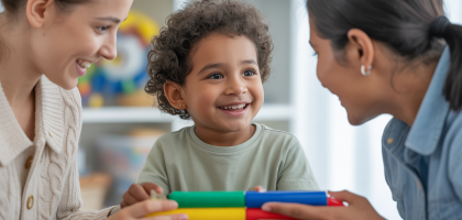 Child with autism happily engaging with a therapist during an ABA therapy session, symbolizing growth and a brighter future