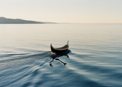 Serene ocean view at sunrise with a ceremonial boat, symbolizing a peaceful full body burial at sea in Southern California.